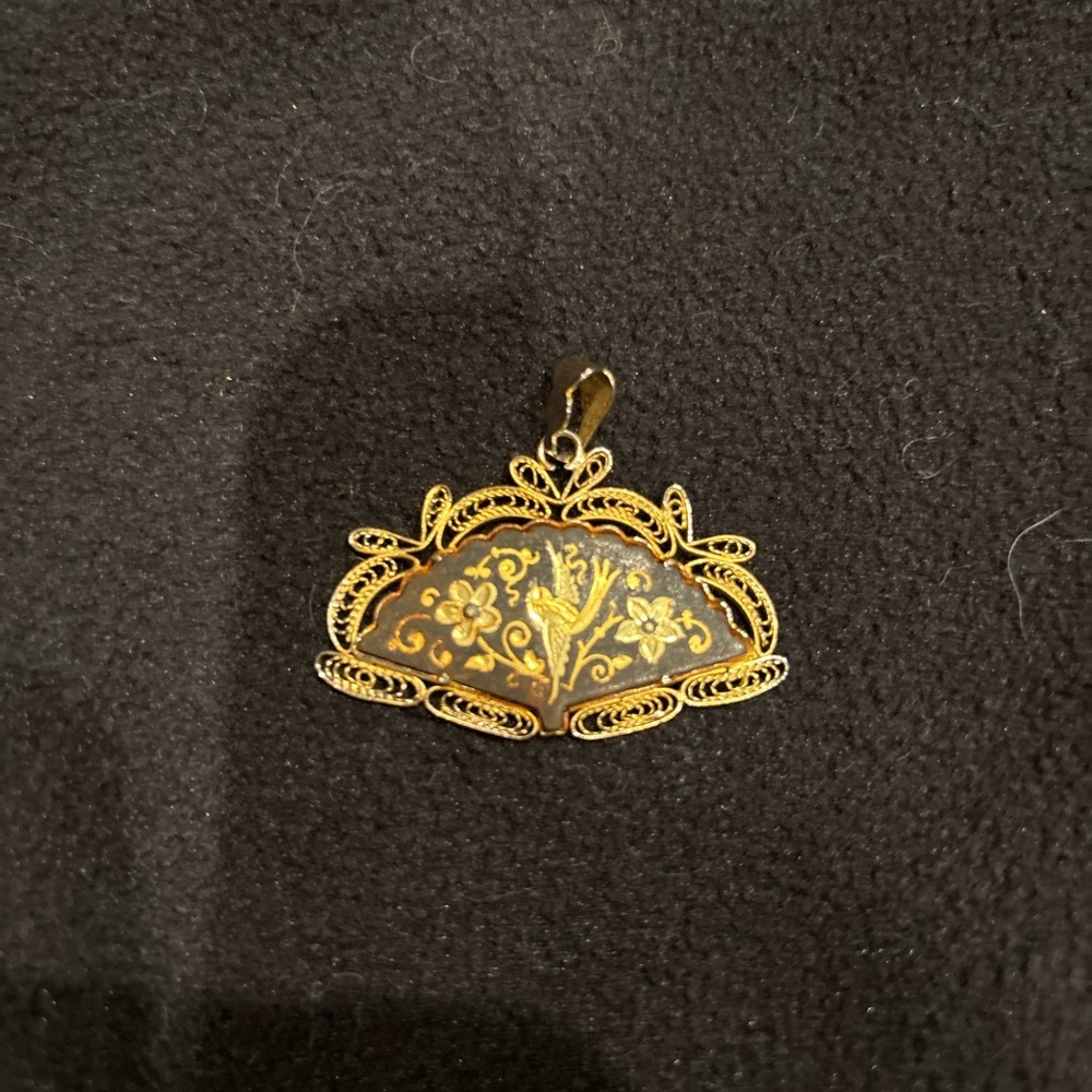 Elegant Gold and Black Pendant
